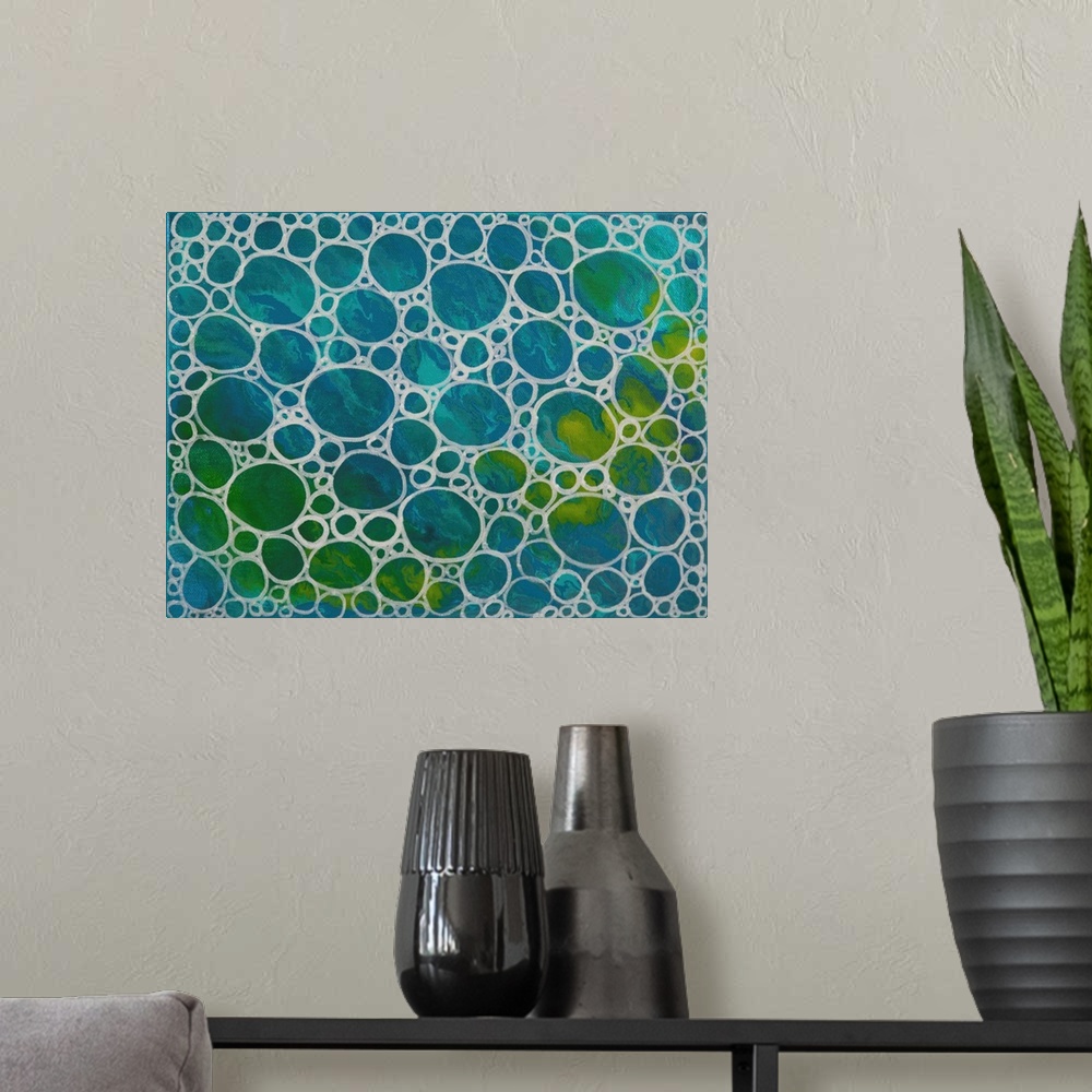 A modern room featuring Contemporary abstract artwork of a close-up view of concentrated air bubbles illuminated by satur...