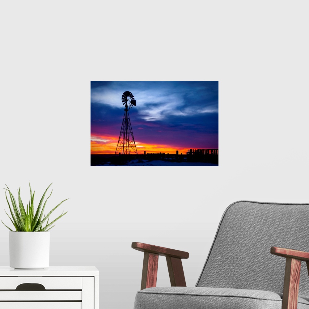A modern room featuring Windmill on a farm at sunrise, color photography