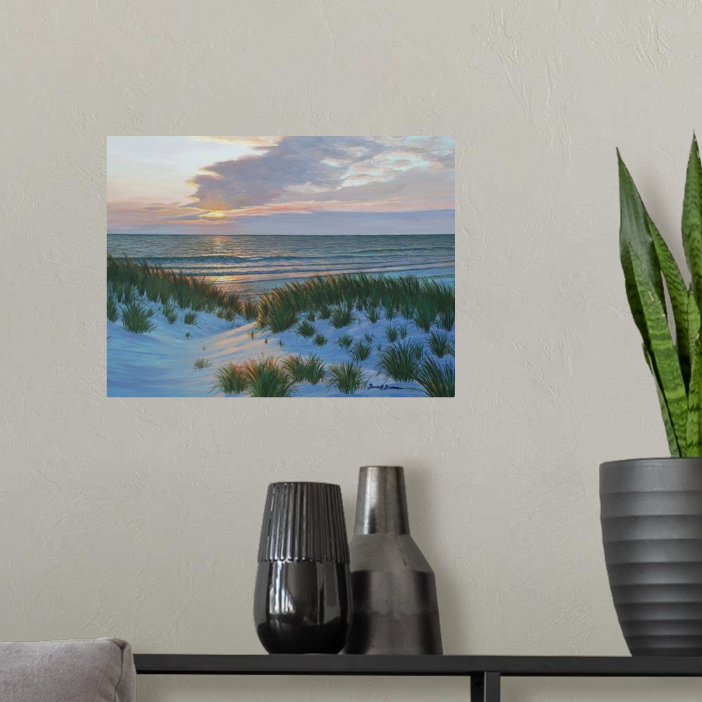 A modern room featuring Contemporary painting of the sun setting across the ocean and sand dunes with beach grass.