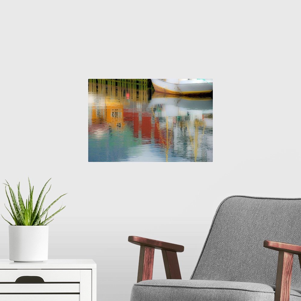 A modern room featuring Reflections of buildings around the harbor onto the water with a boat in the corner.