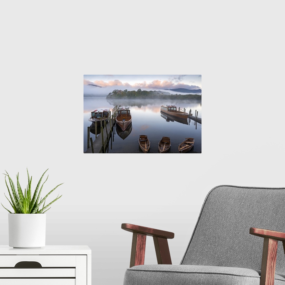 A modern room featuring Small boats docked at wooden piers on a lake in Cumbria.