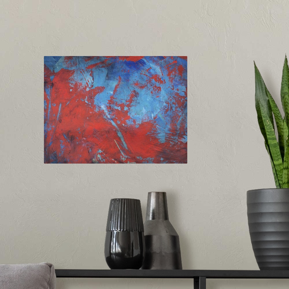 A modern room featuring Abstract painting with red and blue intermingling.