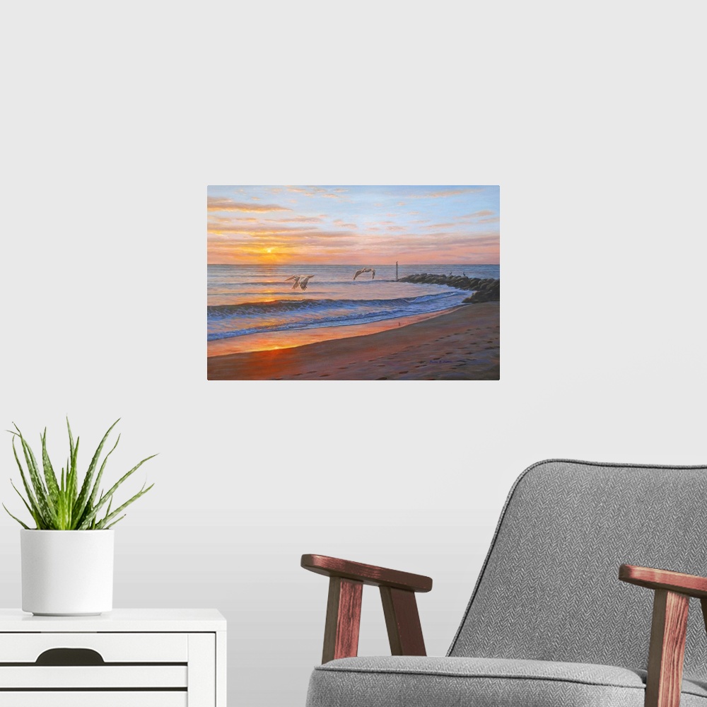 A modern room featuring Contemporary artwork of a beach at sunset with pelicans.