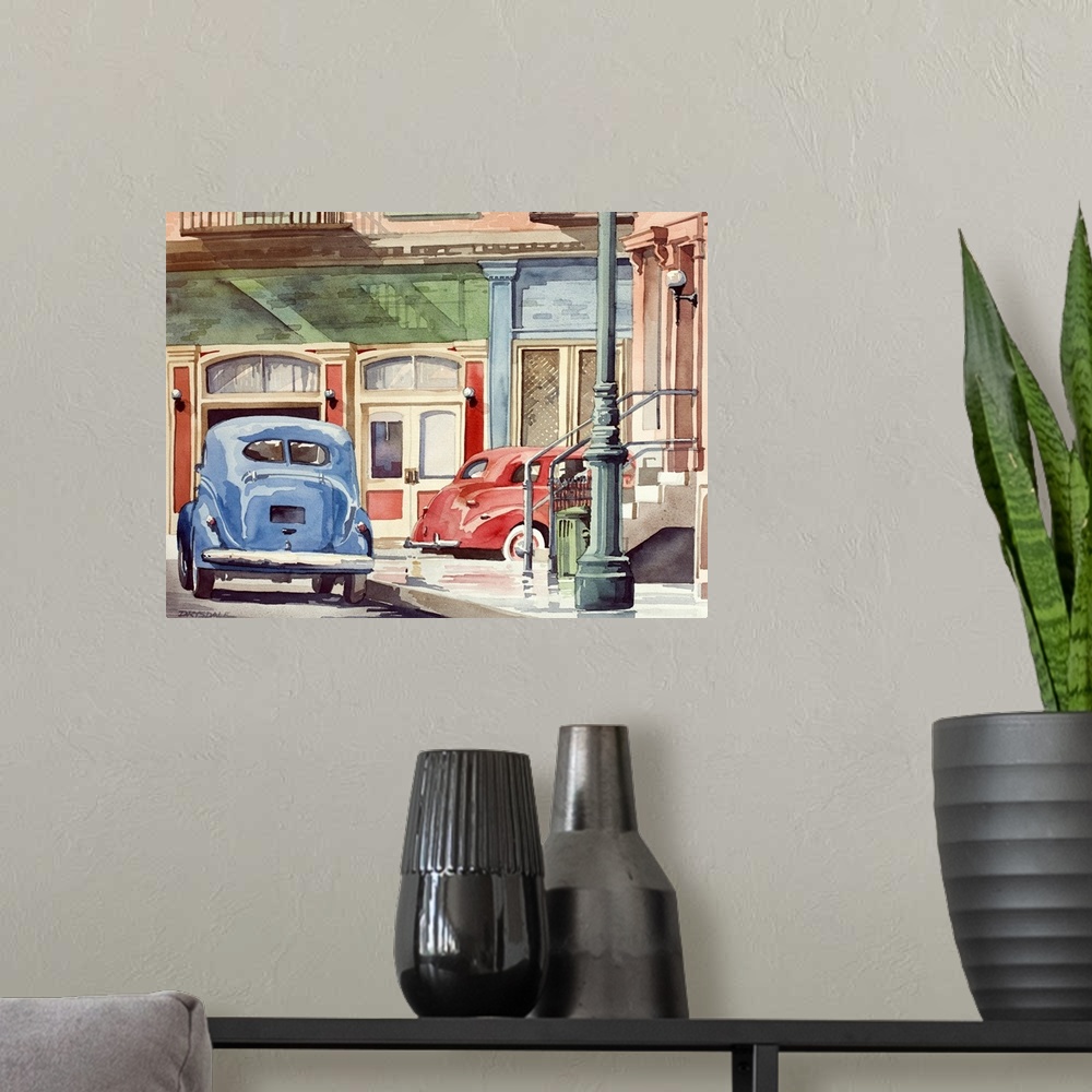 A modern room featuring Contemporary watercolor painting of a red and blue Volkswagen beetles driving down Main Street