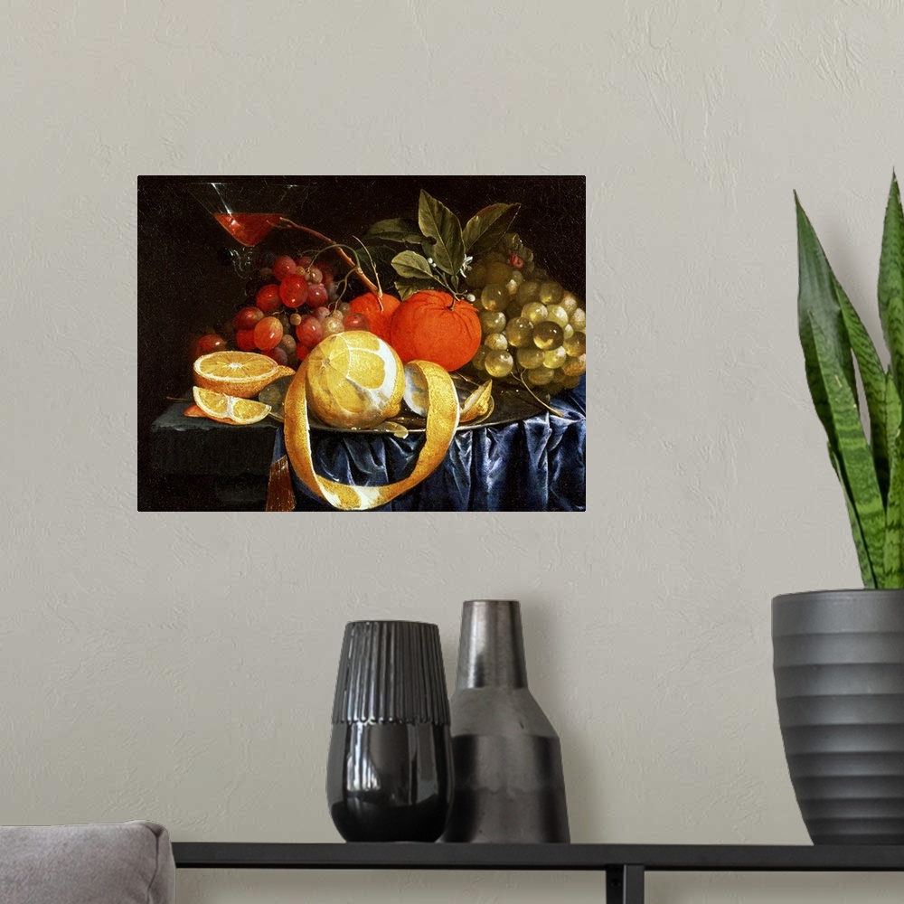 A modern room featuring Classic artwork of different types of fruit sitting in a pile on a table with a martini glass pla...