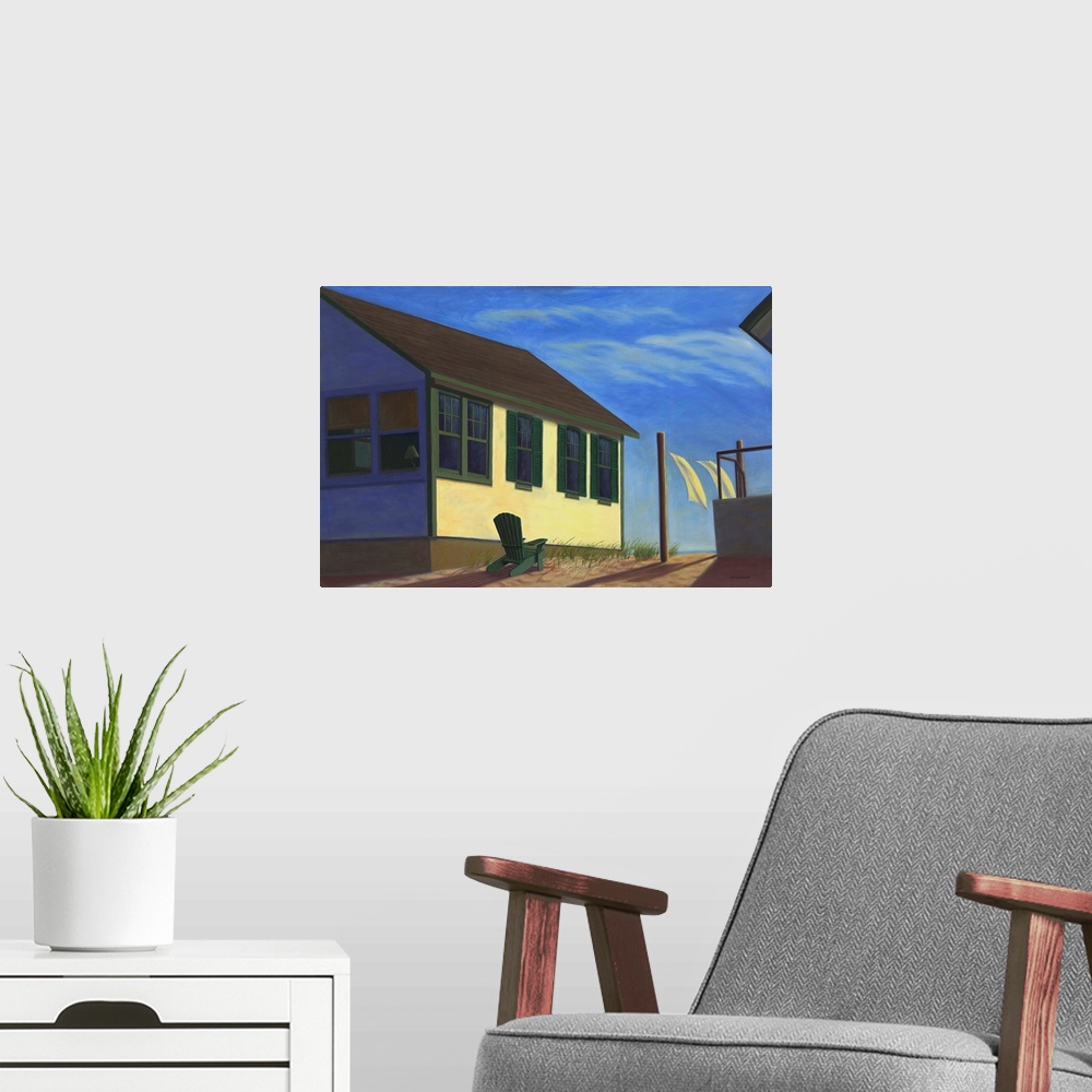 A modern room featuring Contemporary artwork of laundry in the breeze outside a small house.