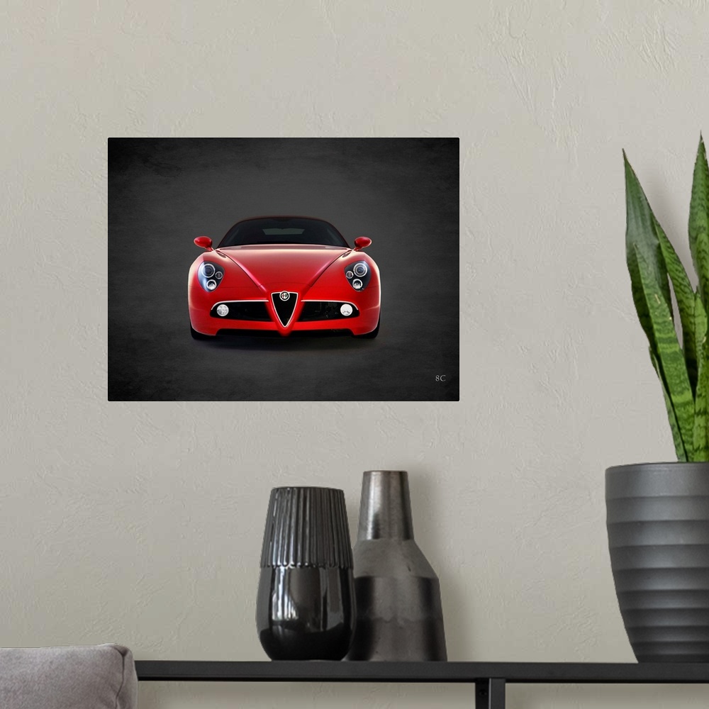A modern room featuring Photograph of a red 2008 Alfa Romeo 8C printed on a black background with a dark vignette.