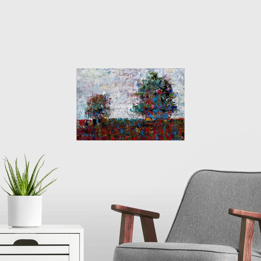 A modern room featuring Abstract landscape with two trees created with many colors and small, layered brushstrokes.