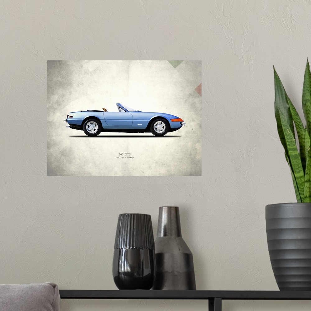 A modern room featuring Photograph of a blue Ferrari 365GTS Daytona Spider printed on a distressed white and gray backgro...
