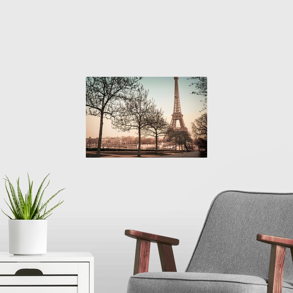 A modern room featuring A muted colored photograph of the Eiffel Tower, viewed from a park sidewalk, in Paris, France.