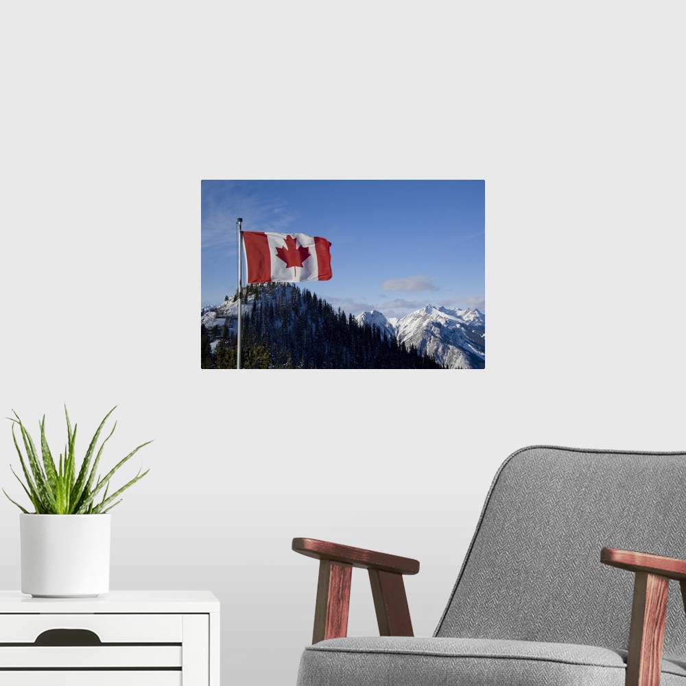 A modern room featuring Canada, Alberta, Banff. Mountain views with Canadian flag on the summit of Sulphur Mountain.