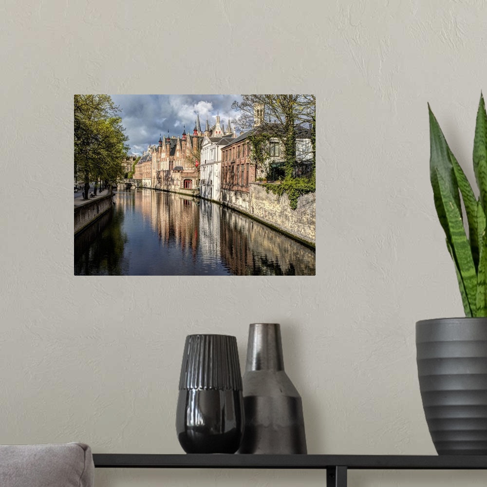 A modern room featuring Belgium, Bruges. Reflections of medieval buildings along canal.