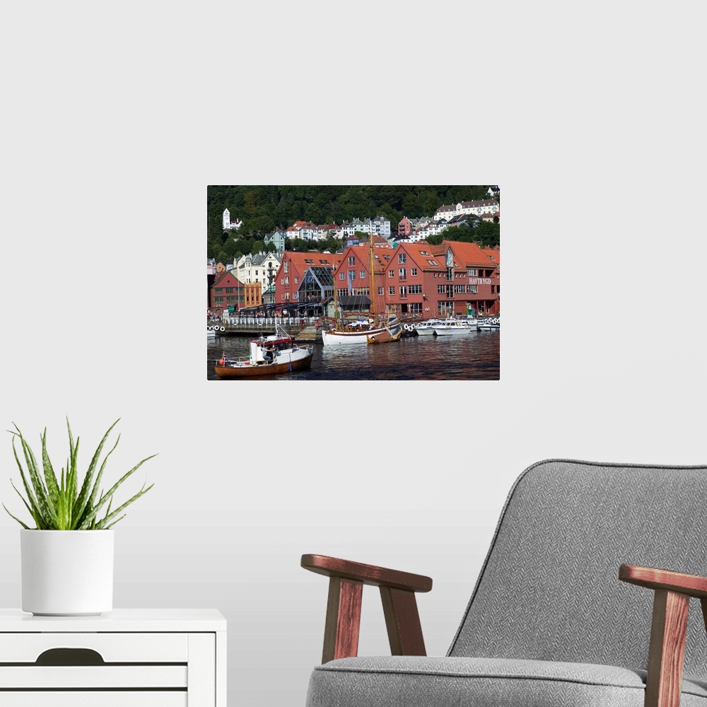 A modern room featuring In the back drop of Bryggens ancient buildings  Bergen's harbor offers tours, and mooring for a v...