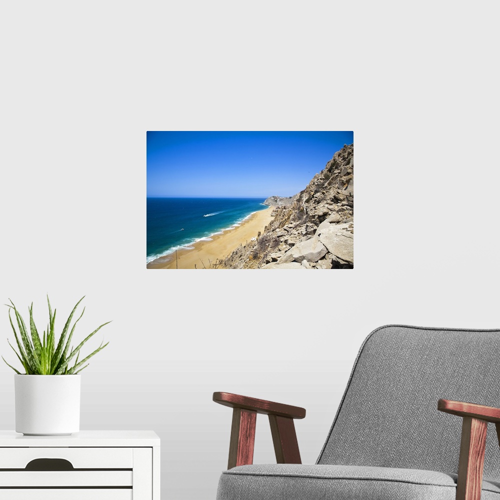 A modern room featuring Cabo San Lucas, Baja California Sur, Mexico. A beach with a large rock formation.