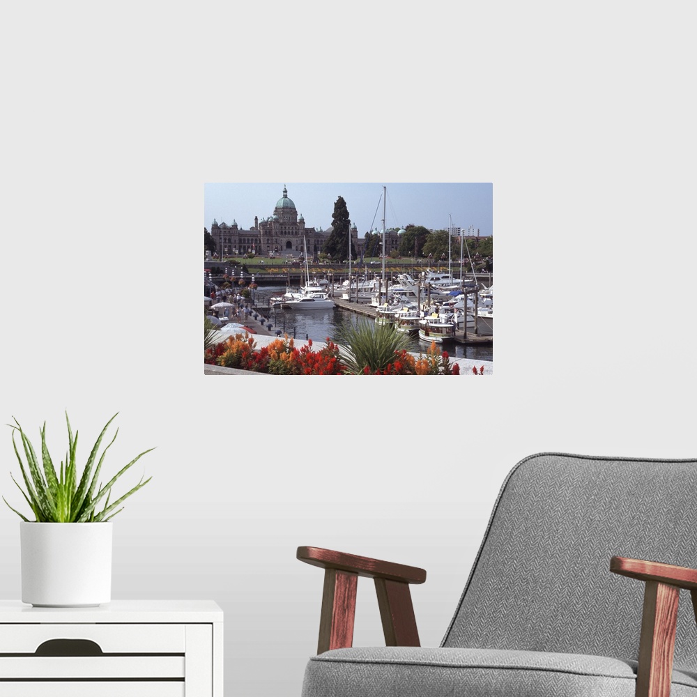 A modern room featuring Canada, British Columbia, Victoria.Parliament Building, with ships and docks in foreground