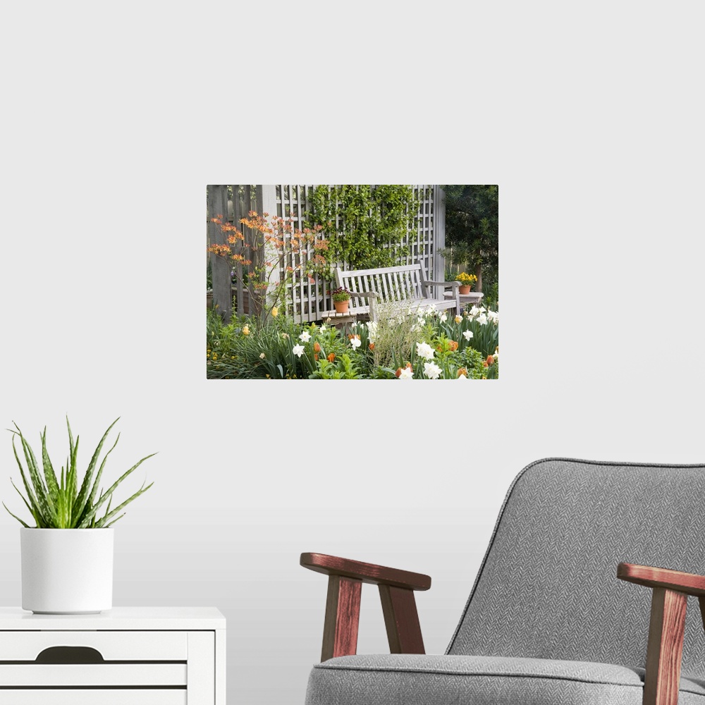 A modern room featuring USA, Georgia, Pine Mountain. Chair in the patio area of a flower garden.
