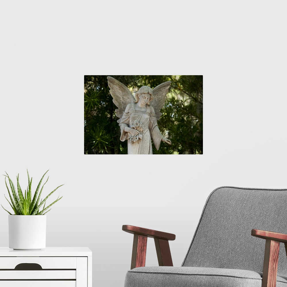 A modern room featuring USA, Georgia, Savannah, Graveyard statue of angel in shady grove inside Bonaventure Cemetery on s...