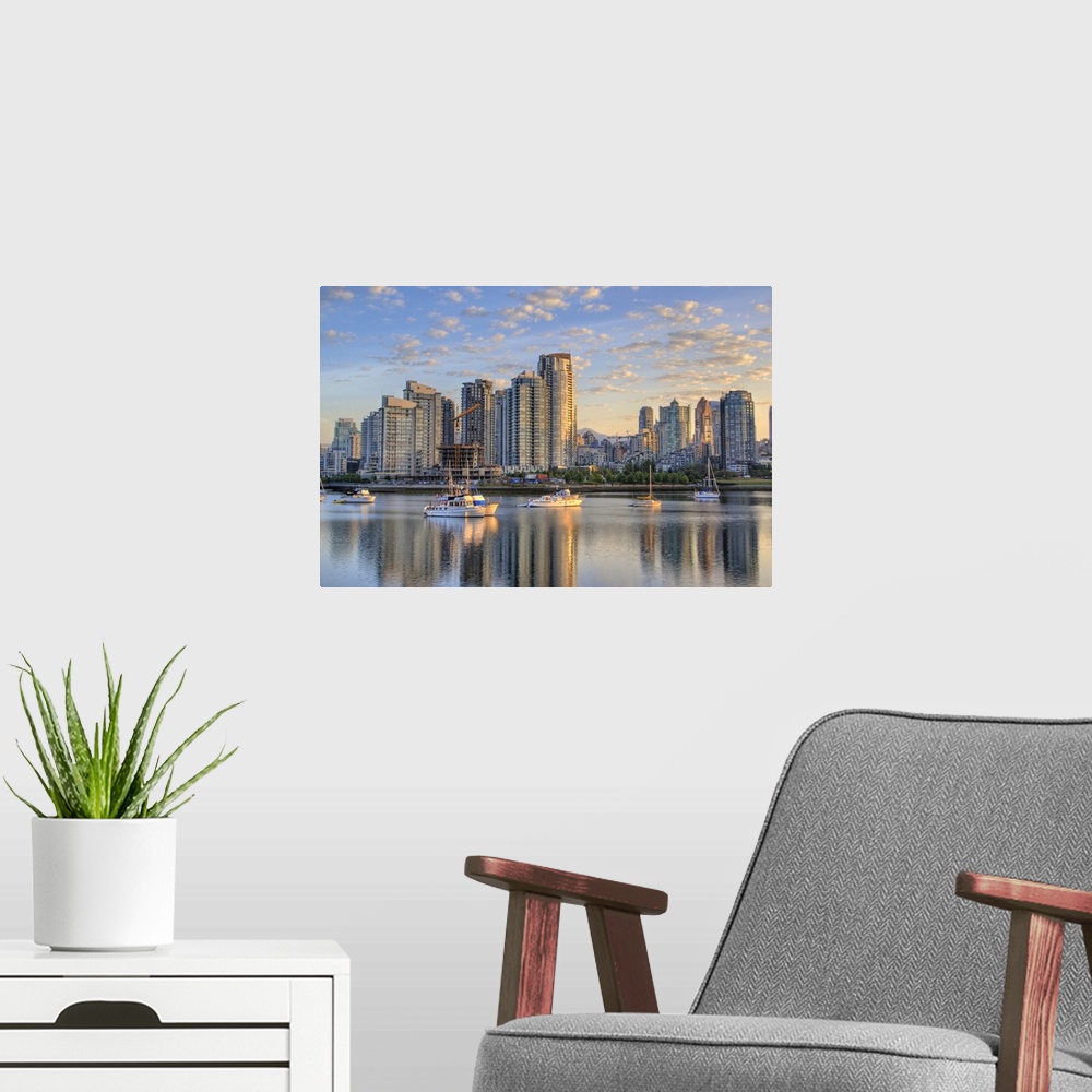 A modern room featuring Looking across False Creek at the skyline of Vancouver British Columbia at sunrise