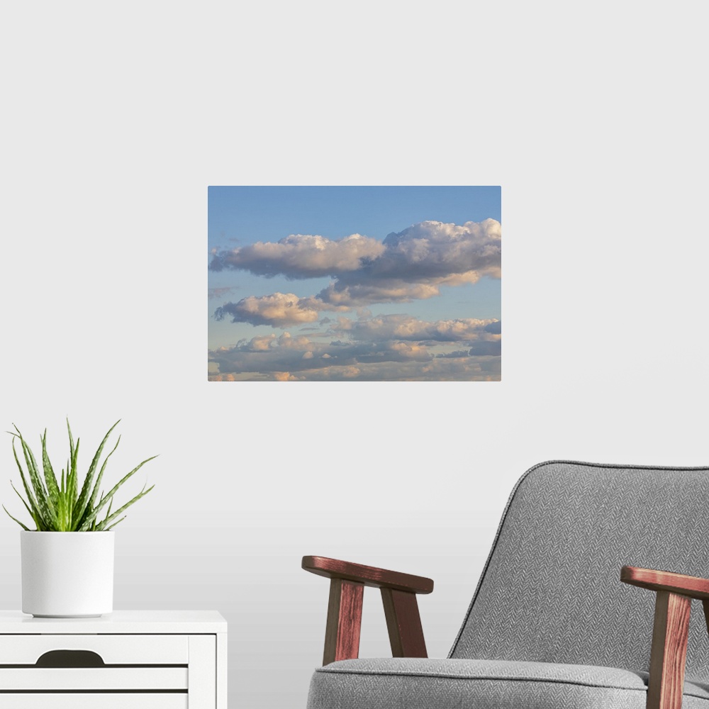 A modern room featuring New York City, New York, USA. Clouds over New York City in late afternoon. United States, New Jer...
