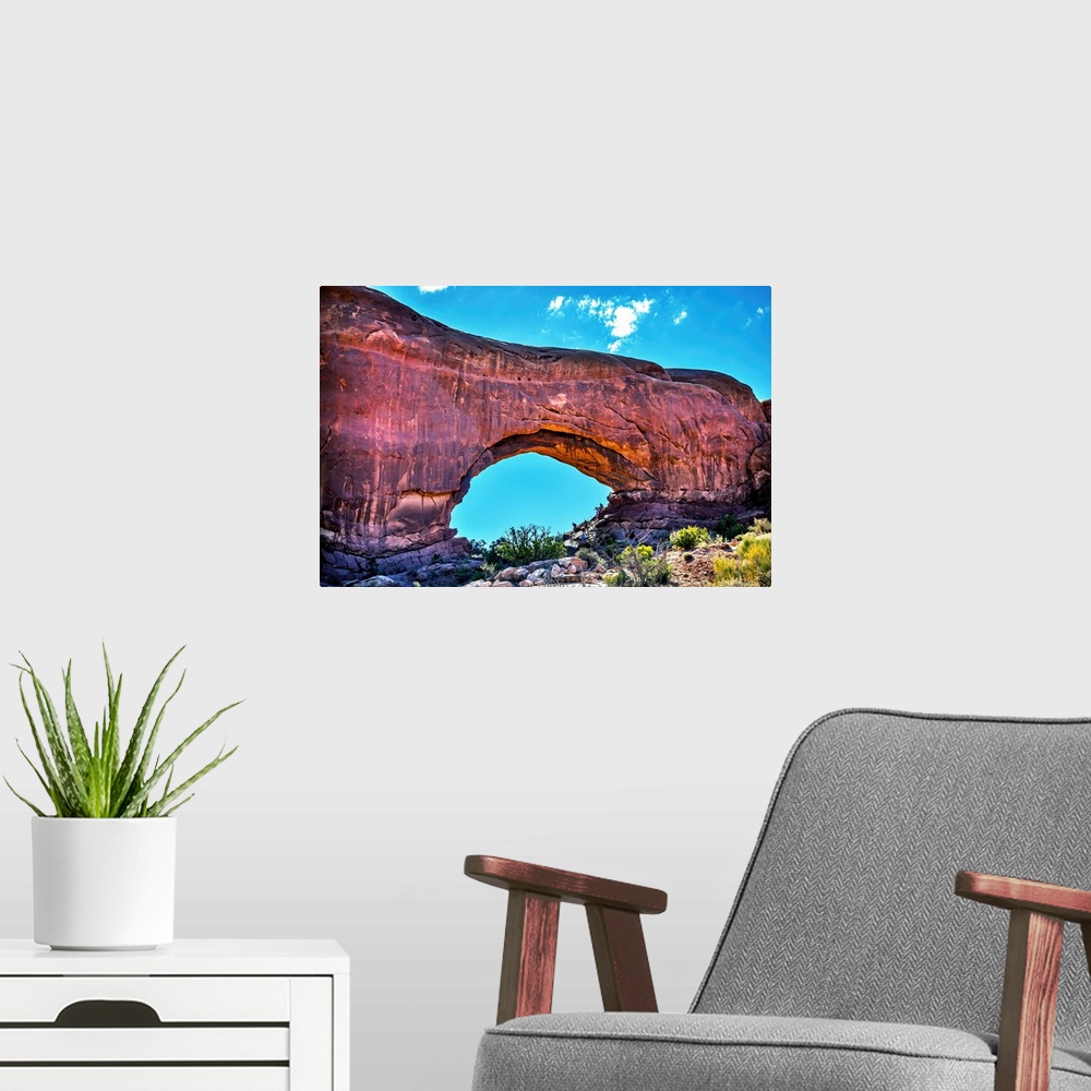 A modern room featuring North window Arch Windows Section Arches National Park, Moab, Utah, USA. Red canyon walls and blu...