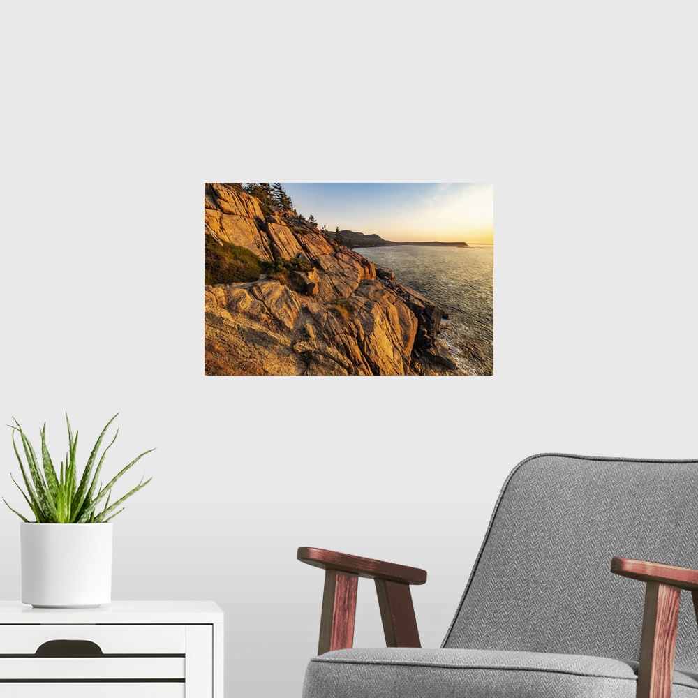 A modern room featuring Otter Cliffs at sunrise in Acadia National Park, Maine, USA.