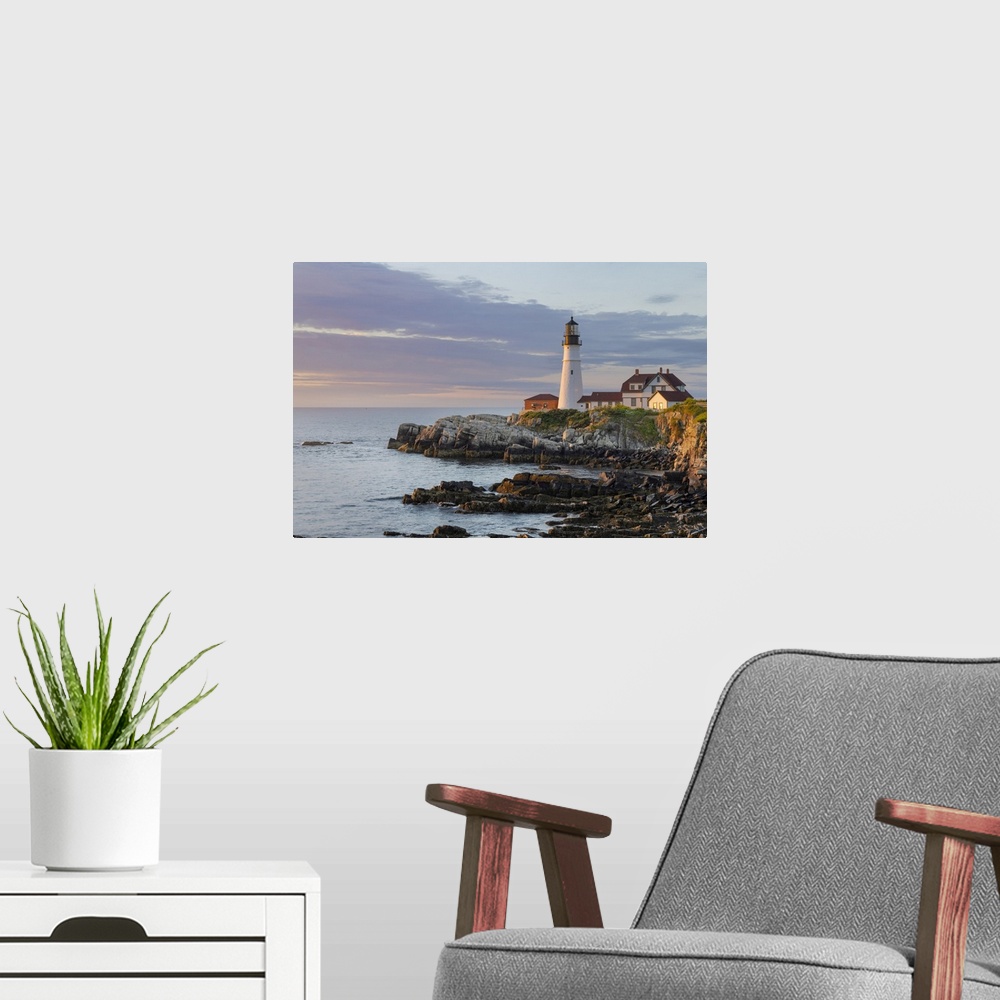 A modern room featuring Portland Head Lighthouse in sunrise light in Portland, Maine, USA.