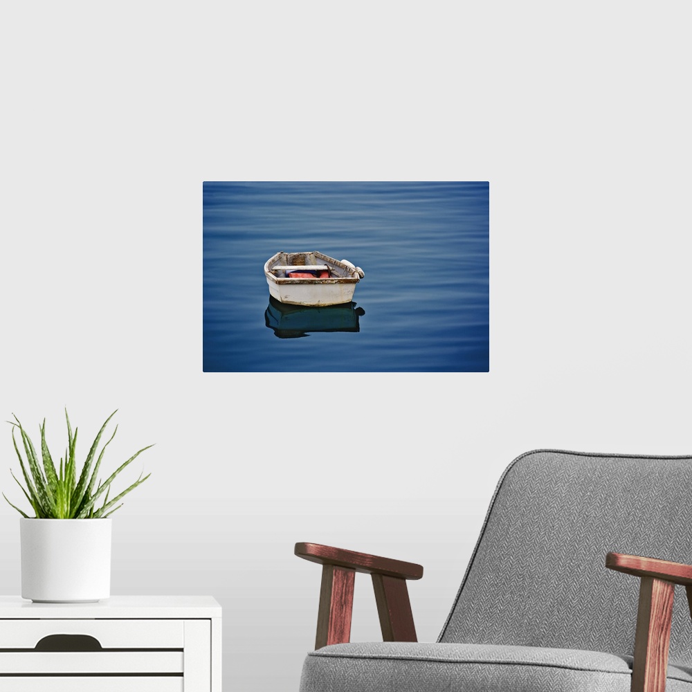 A modern room featuring Single small boat floating on ocean, Maine