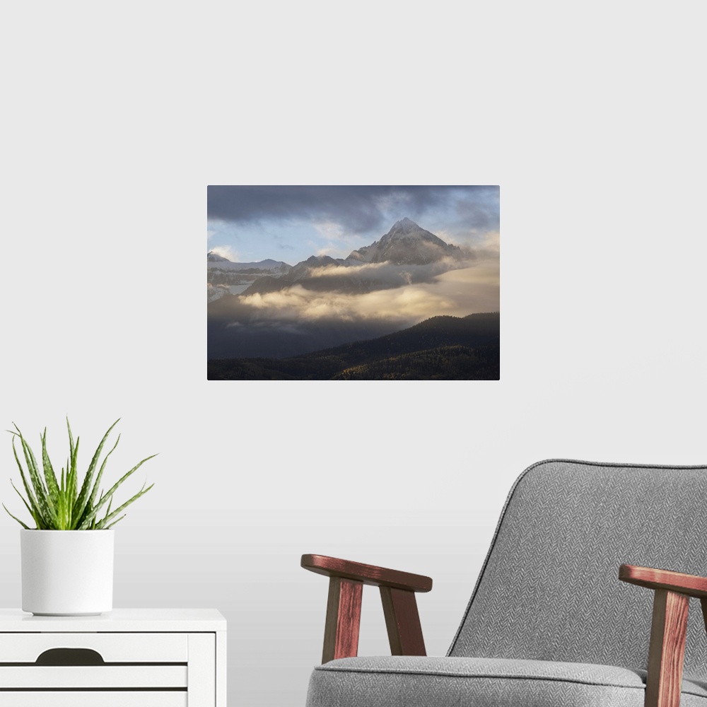 A modern room featuring USA, Colorado, Uncompahgre National Forest. Sunrise on clouds below Mount Sneffels. United States...
