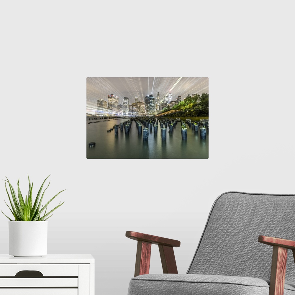 A modern room featuring USA, New York. Downtown view from Pier 1, wooden pilings in front of river in Brooklyn Heights. U...