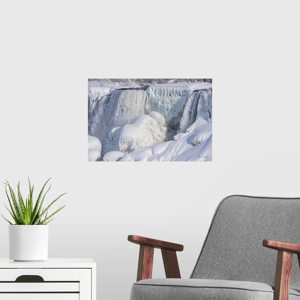 A modern room featuring Niagara fall freezing over in a cold winter.