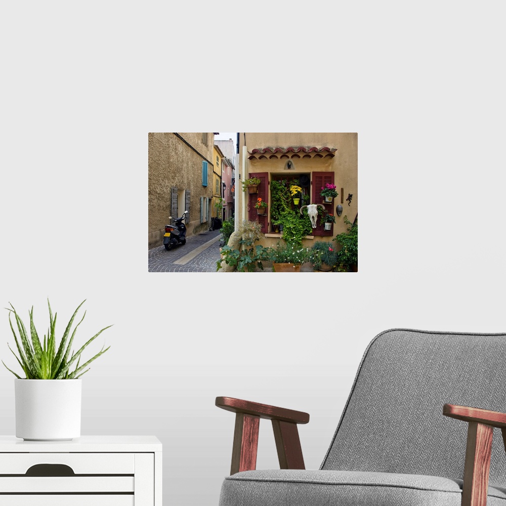 A modern room featuring The seaside town of cassis, old street, European town, a journey through France.