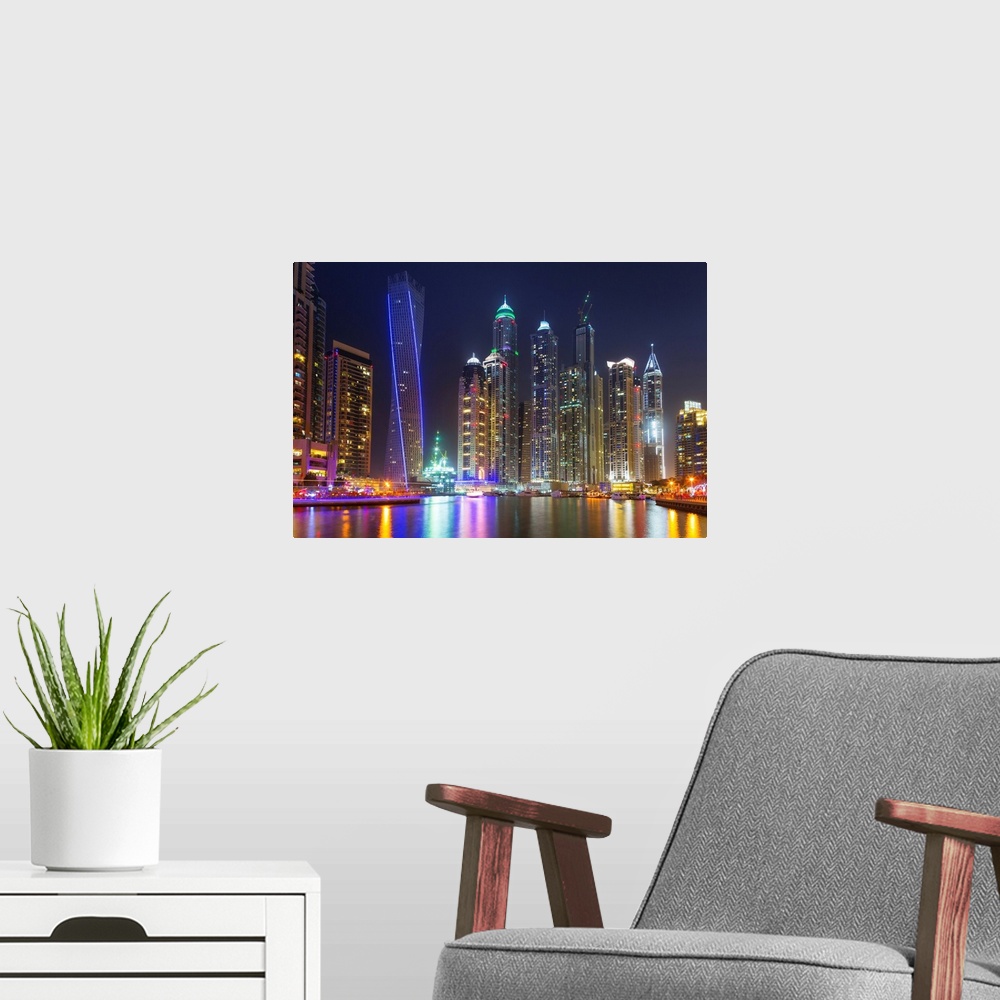 A modern room featuring Dubai marina at night in United Arab Emirates.