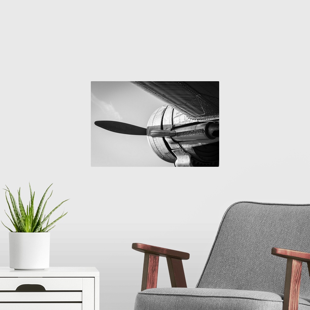 A modern room featuring Old vintage jet engine in black and white.