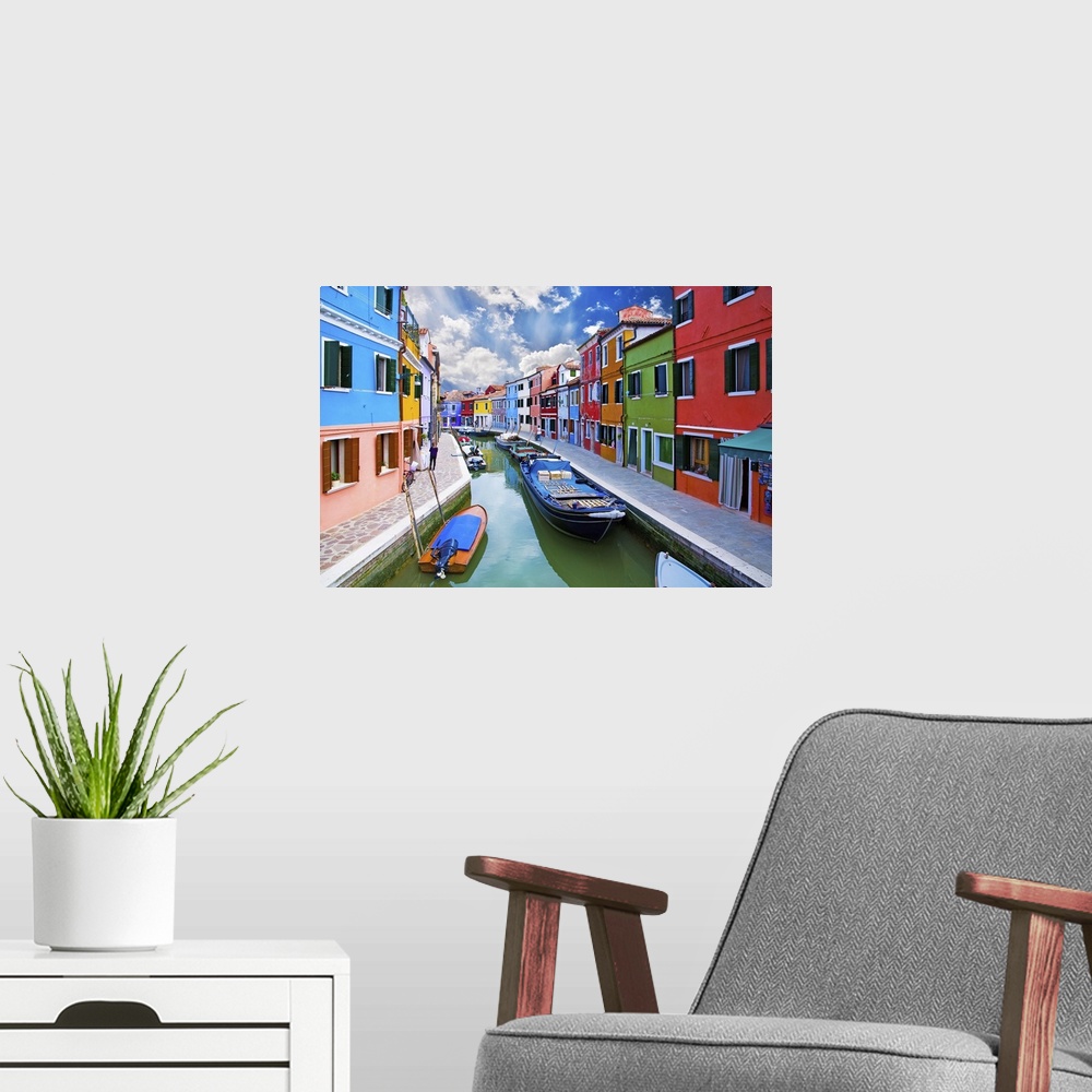 A modern room featuring Venice, Burano Island Canal. Small colored houses and the boats.
