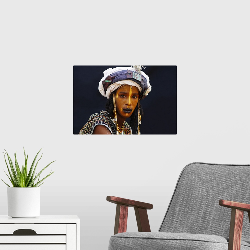 A modern room featuring Niger, A Wodaabe-Bororo boy with his face painted for the annual Gerewol male beauty contest