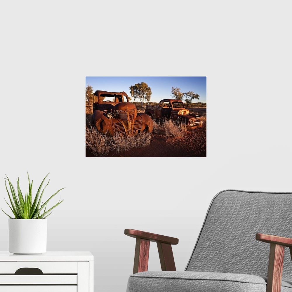 A modern room featuring Australia, Northern Territory, Oceania, Devil's Marbles, old car wreck in the desert