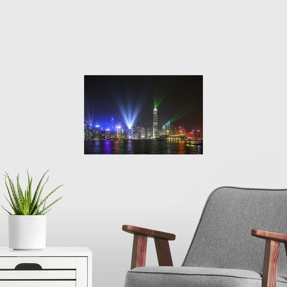 A modern room featuring China, Hong Kong, Hong Kong island, Skyline of the Central during the Symphony of Lights light an...