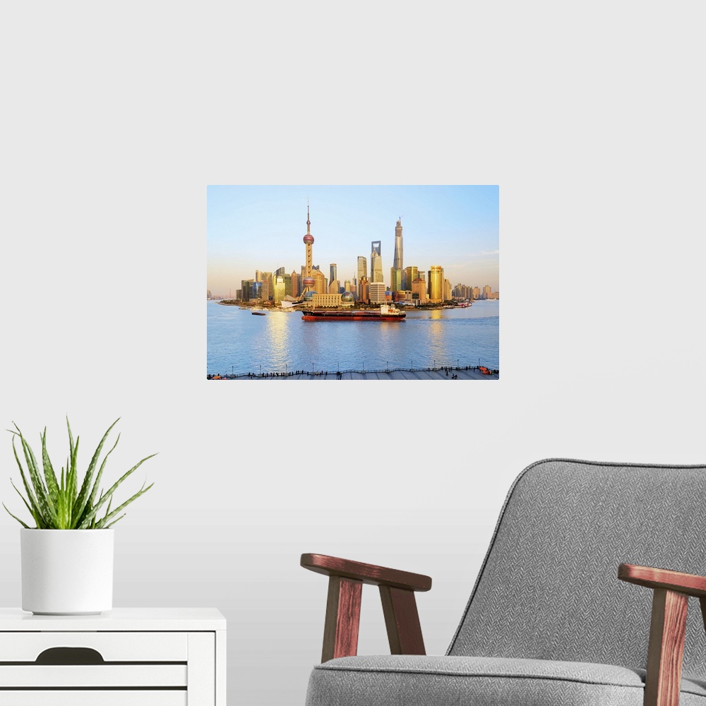 A modern room featuring China, Shanghai, Pudong, Oriental Pearl Tower, High view of Lujiazui Financial District skyline w...