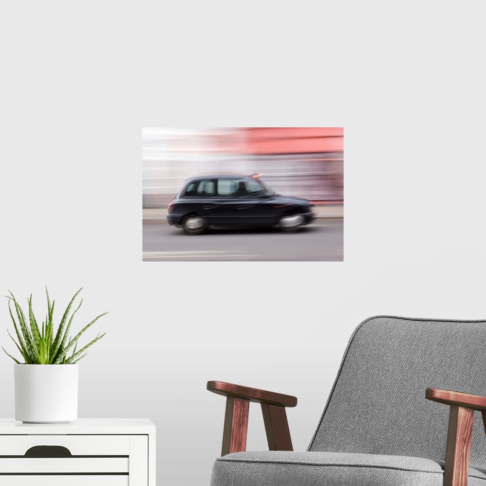 A modern room featuring United Kingdom.London.A typical taxi-cab.
