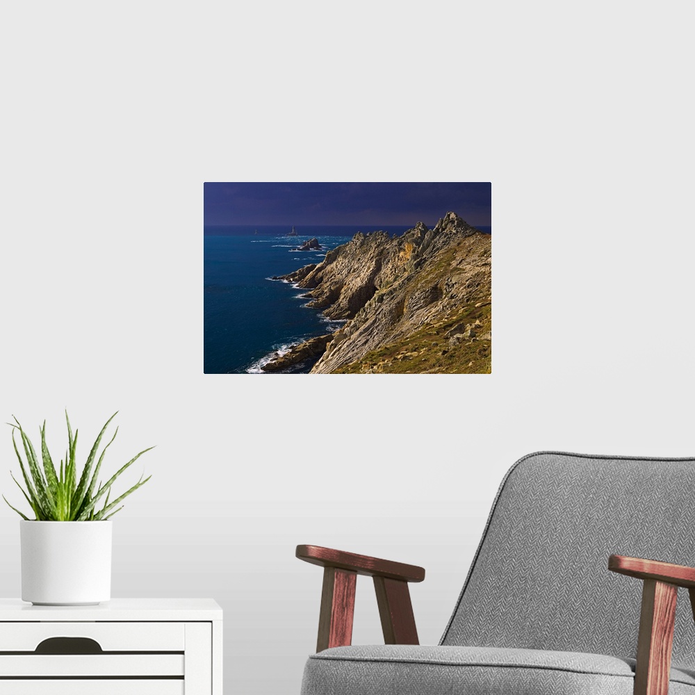 A modern room featuring A storm approaching the cliffs at Pointe du Raz, with the famous lighthouse out in the Atlantic o...