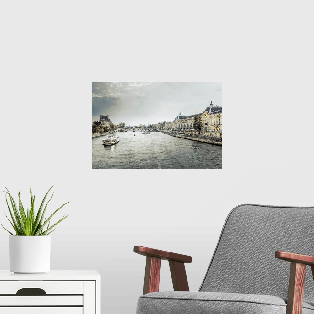 A modern room featuring France, Paris, Exterior view of the Musee D'Orsay art gallery with River Seine, The Pont Royal an...