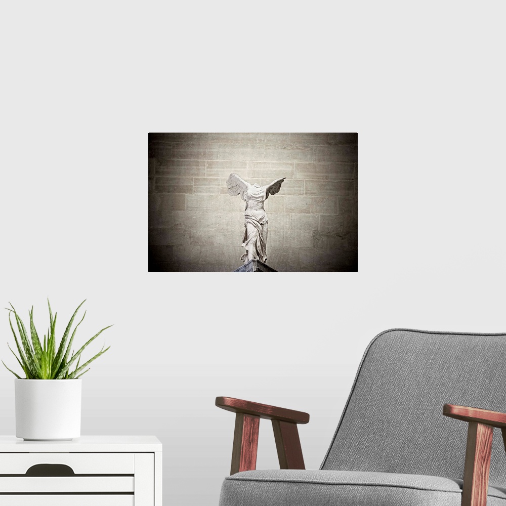 A modern room featuring France, Paris, The Louvre, The Winged Victory of Samothrace, also called Nike of Samothrace.