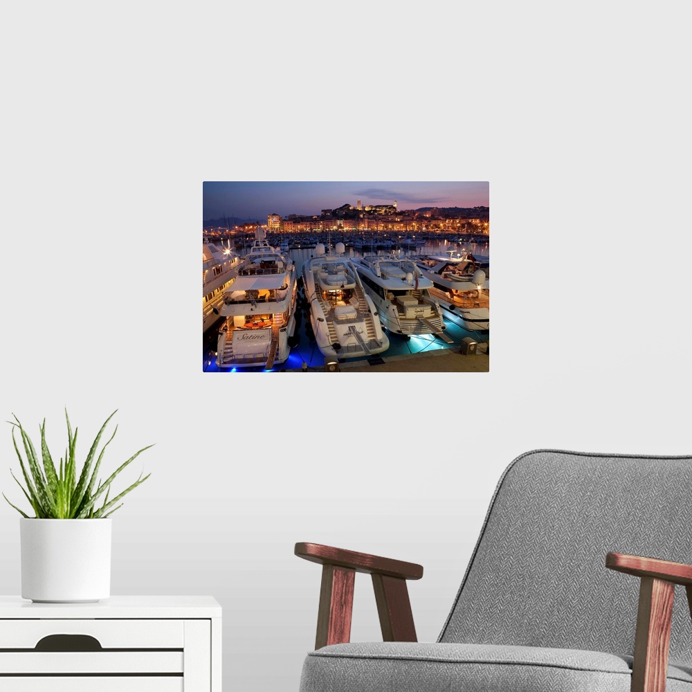 A modern room featuring France, Provence-Alpes-Cote d'Azur, Alpes-Maritimes, Cannes, Cannes, dusk