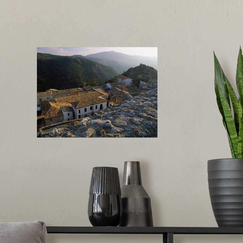 A modern room featuring Italy, Calabria, Ionian Coast, Squillace, View of the village from the Castle