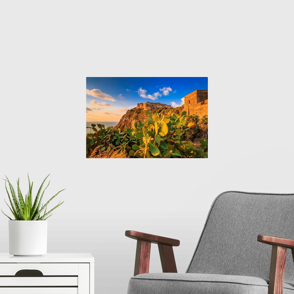 A modern room featuring Italy, Sicily, Messina district, Mediterranean sea, Milazzo, Castle at sunset.
