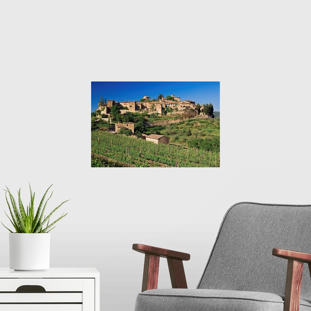 A modern room featuring View of the medieval village of Montefioralle, perched on a hill surrounded by vineyards and oliv...