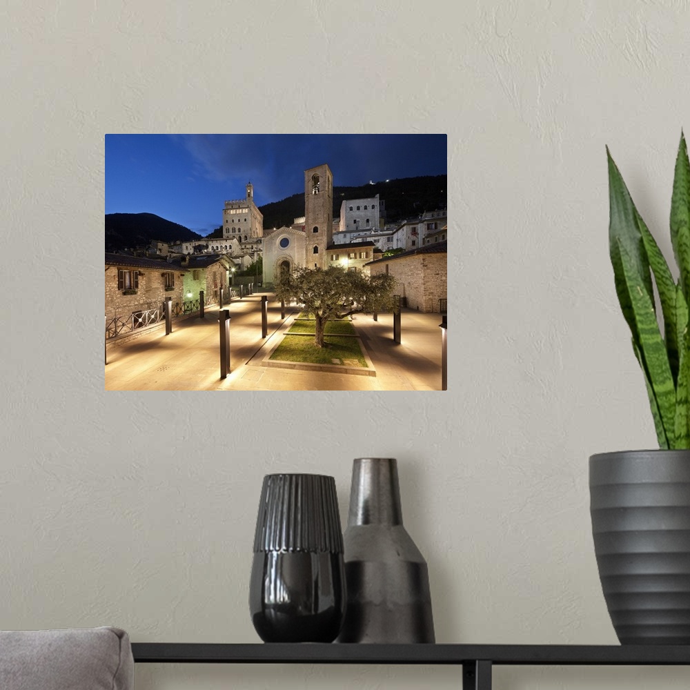 A modern room featuring Italy, Umbria, Mediterranean area, Perugia district, Gubbio, View of Piazza San Giovanni with San...