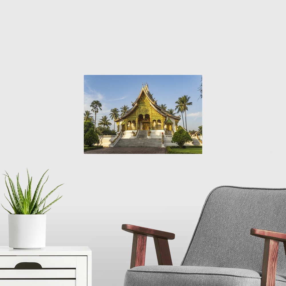 A modern room featuring Laos, North Region, Luang Prabang, The intricately adorned facade of Wat Haw Pha Bang temple in L...
