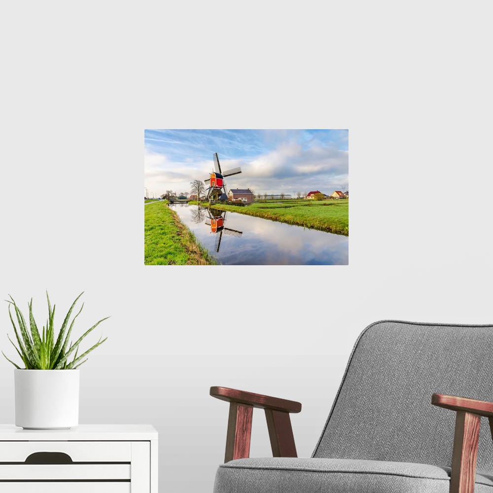 A modern room featuring Netherlands, North Holland, Benelux, Hoorn, Windmill on a thatched house in the countryside.