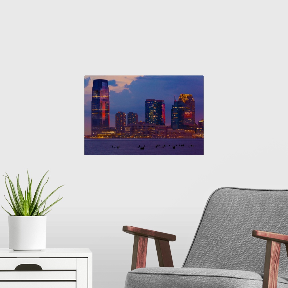 A modern room featuring USA, New Jersey, Hudson, View from Manhattan in the evening.